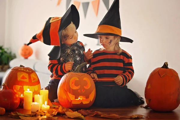 Adorable children, toddler boy and girl, playing with Halloween — Stock Photo, Image
