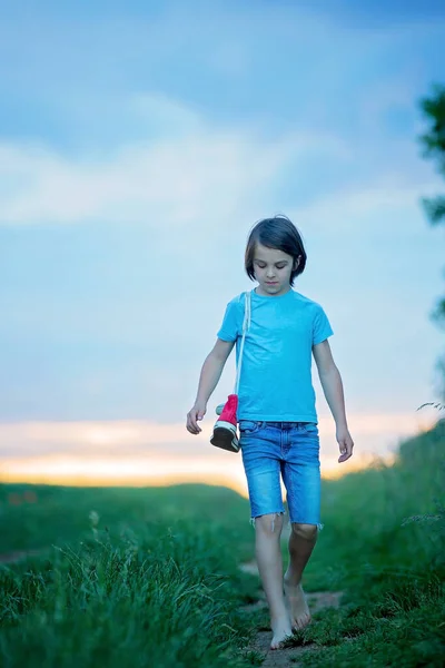 Happy Child Holding Pair Sneakers Hands Walking Rural Path Barefeet — Stock Photo, Image