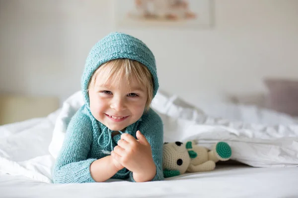 Cute Toddler Boy Handmade Knitted Toy Lying Bed Smiling Happily — Stock Photo, Image