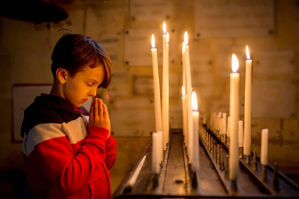 Little Toddler Boy Praying Chapel Candles Front Him — Stock Photo, Image