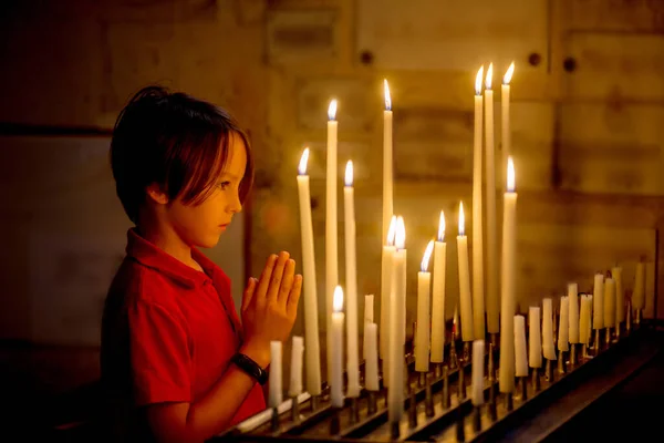 Little Toddler Boy Praying Chapel Candles Front Him — Stock Photo, Image