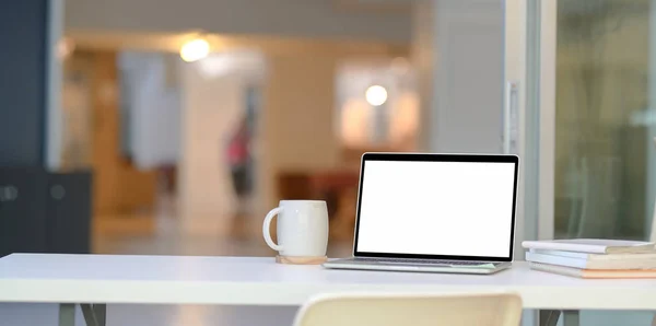 Stylish home-office with open blank screen laptop computer — Stock Photo, Image