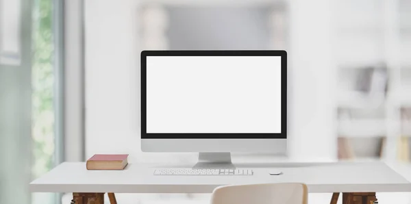 Modern workspace with desktop computer and decorations on white table and blurred background — ストック写真