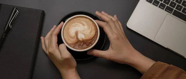 Overhead Shot Female Hands Holding Black Cup Coffee Dark Workspace — Stock Photo, Image