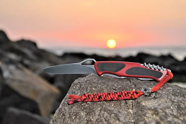 Pocket folding knife lanyard para cord nature beautiful sunset landscape