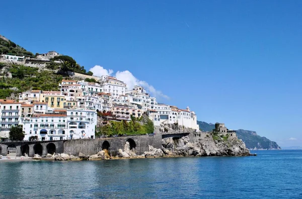 Old Mediterranean Italian town Amalfi coastline nature panorama blue sky mountains clouds horizon sea bay background