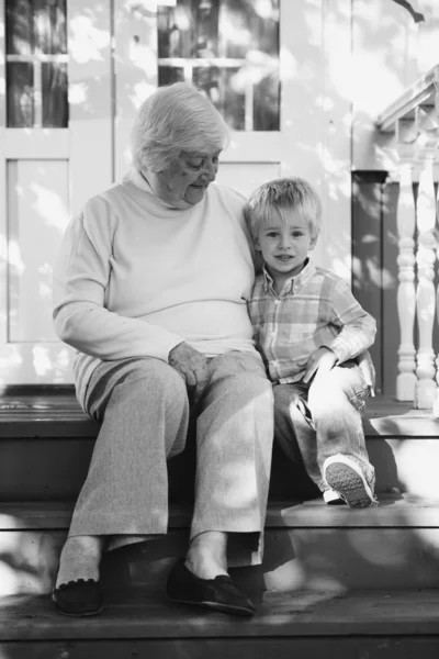 Summer evening, grandmother and grandson, black and white portrait