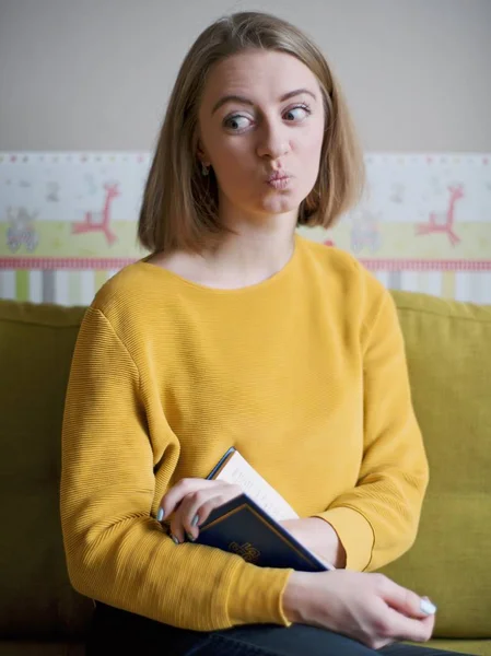 Woman leafing through and studying dictionaries