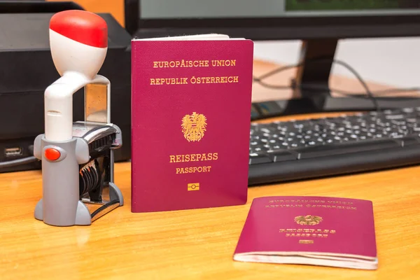 Close-up of Austrian biometric passport with a date stamper, int