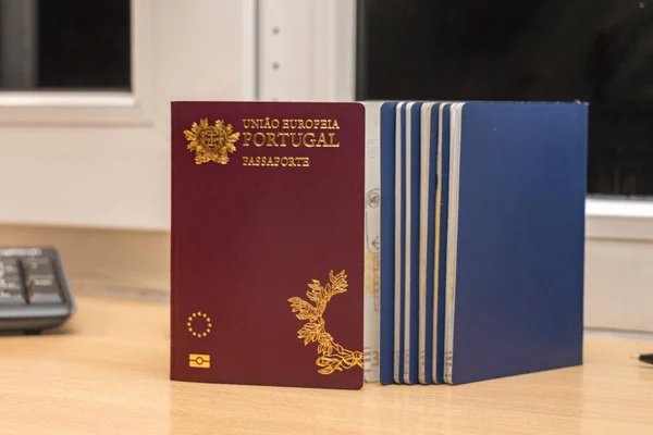 Close-up of a Portuguese biometric passport along with other pas — Stock Photo, Image