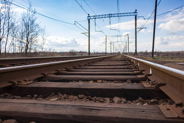 Railway with rails on wooden sleepers 