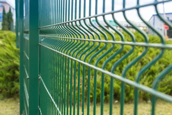 Green sectional steel fence — Stock Photo, Image