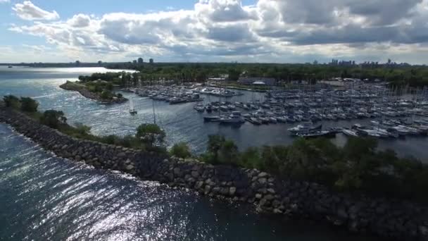 Drone Making Wide Turn Sea Wall Protecting Marina Boats — Stock Video