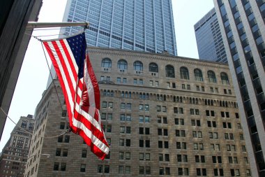 US Flag flying on the background of the facade of the Federal Reserve building in New York clipart
