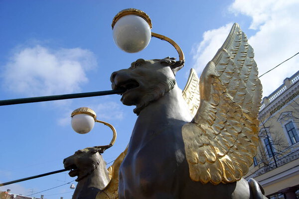 Lanterns in the shape of winged lions at Bankers' Bridge in St. Petersburg, Russia