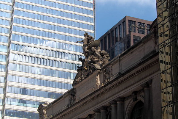 Glory of Commerce, a sculptural group by Jules-Felix Coutan, with the clock, on the southern facade of Grand Central Terminal, New York, NY, USA - August 11, 2020