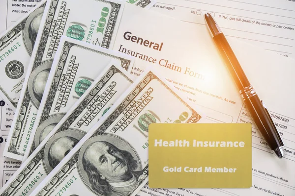 health insurance card and bank note and pen on background of gen
