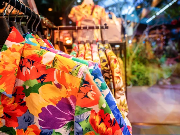 Aloha shirt hanging on rack in fashion retail store