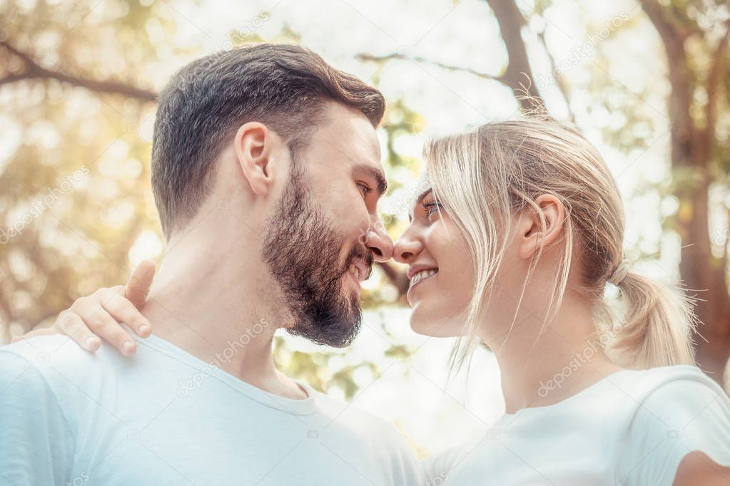 caucasian lovers close up face to face falling in love