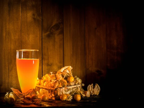 Still life of cape gooseberries and a glass of cape gooseberry j