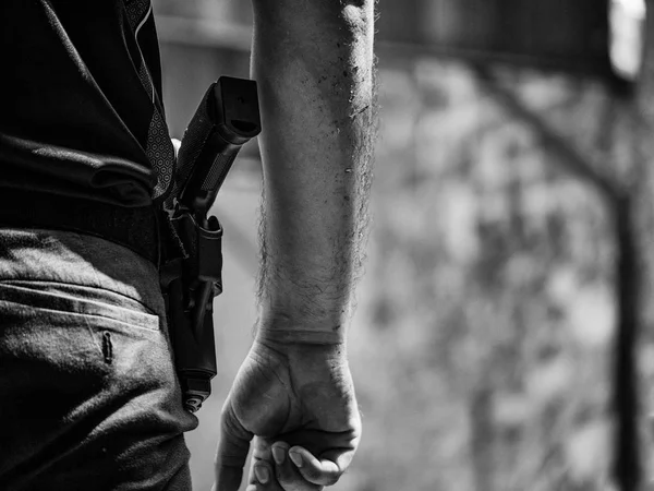 Black and white image of male with handgun in holster standby fo — Stock Photo, Image