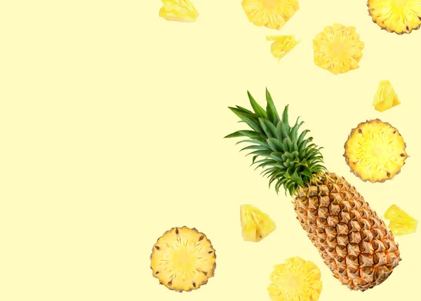 Natural fresh fruit background of pineapple on yellow background — Stock Photo, Image