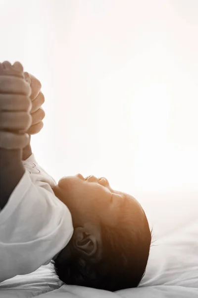 African American Infant Baby Lying Bed While Mother Hands Pull — Stock Photo, Image