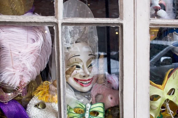 Masquerade mask in a window display.