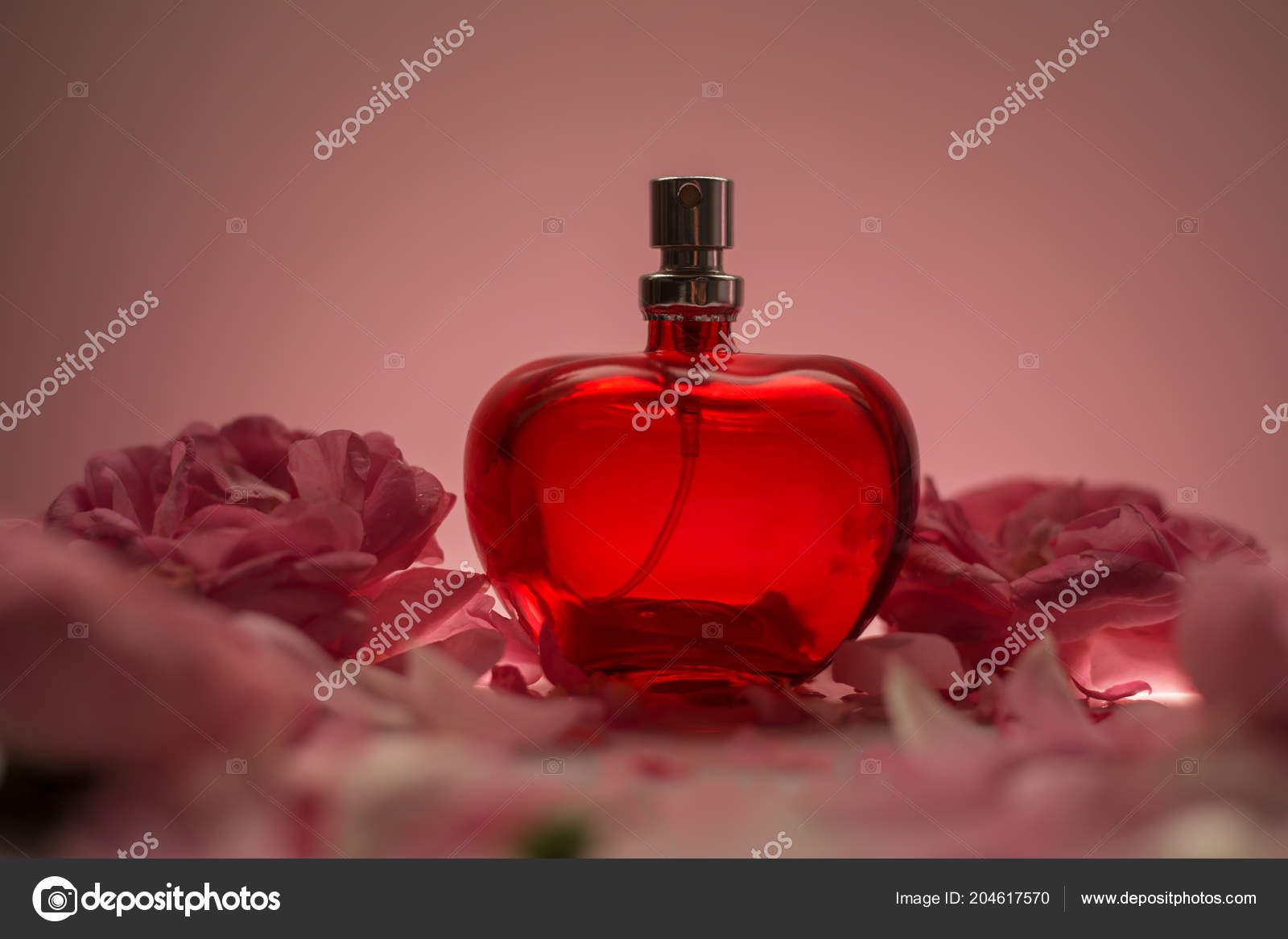 perfume with red flower on bottle