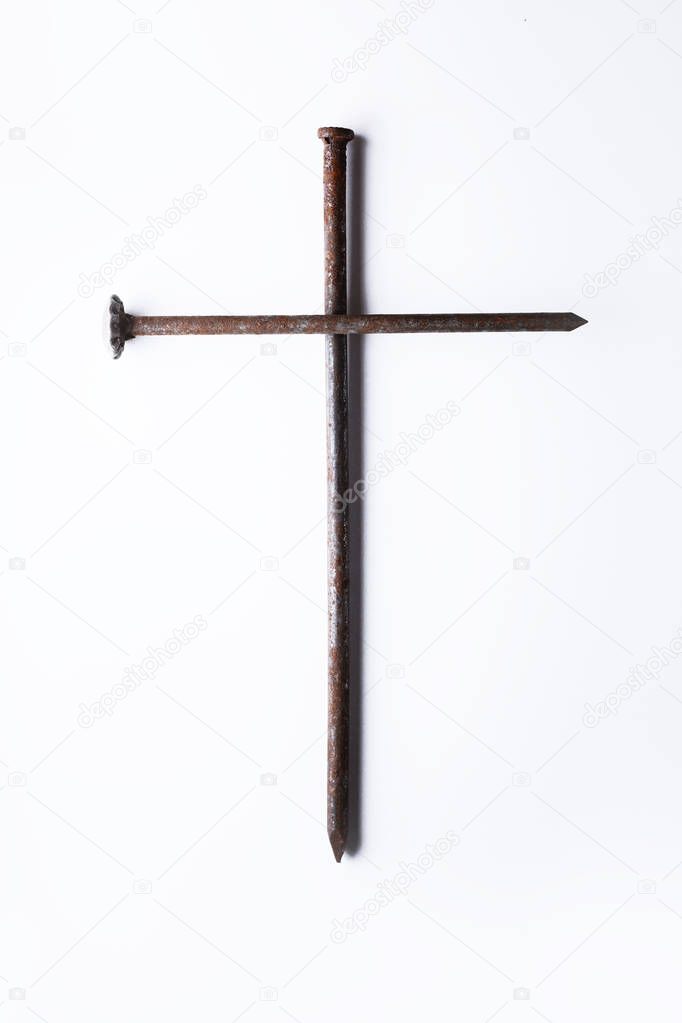 Symbolic cross of nails on white background 