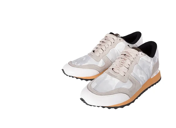Hvide stilfulde sneakers på en lys baggrund - Stock-foto