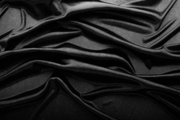 滑らかなエレガントな黒シルクやサテンのテクスチャは 抽象的な背景として使用することができます 豪華な背景デザイン — ストック写真