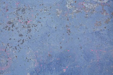 Eski mavi duvar dokusu ve kabuğu soyulmuş.