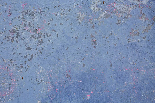 Eski mavi duvar dokusu ve kabuğu soyulmuş.