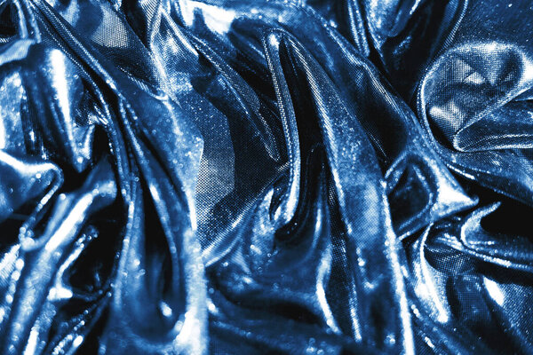  Текстура синей ткани в волнах
.