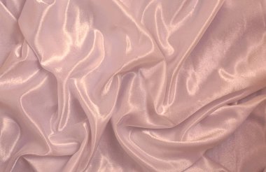 Pembe zarif ipek ya da saten lüks kumaş dokusu düğün arka planı olarak kullanılabilir. Lüks arkaplan tasarımı