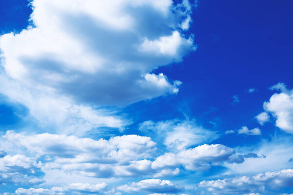 Clear blue sky with white clouds