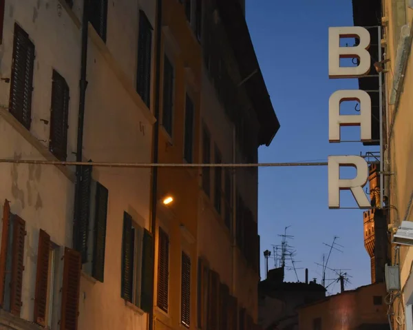 Bar Sign And Street Scene At Sunset, Florence, Italy.