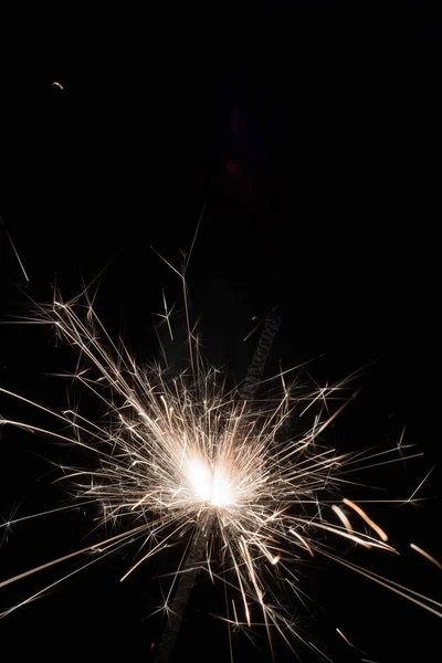 Bright sparks of Bengal fire on a black background. — Stock Photo, Image