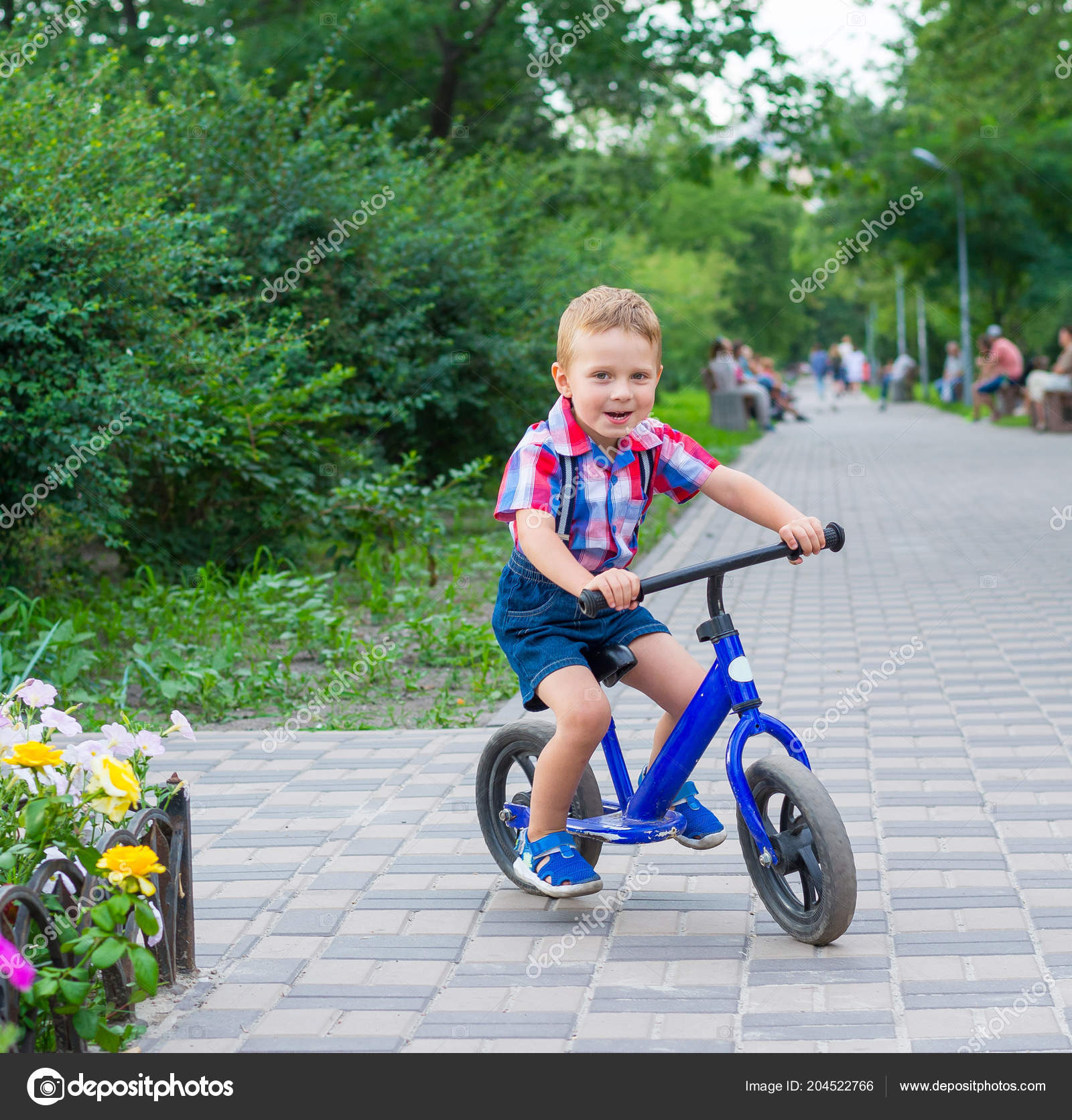 little boy riding bike