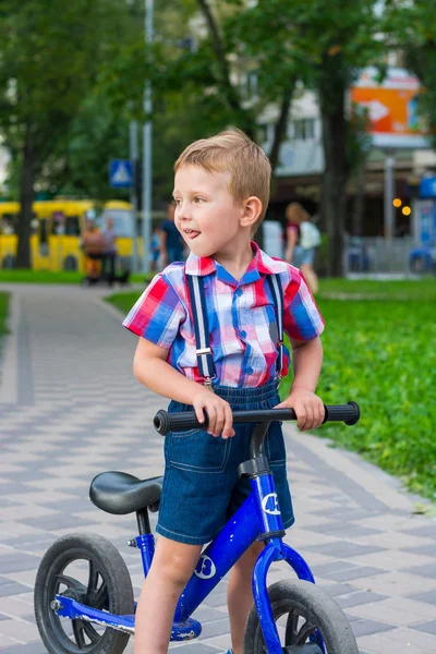 Little Boy Riding Bike Ride His Tongue Out Park Summer — Stock Photo, Image