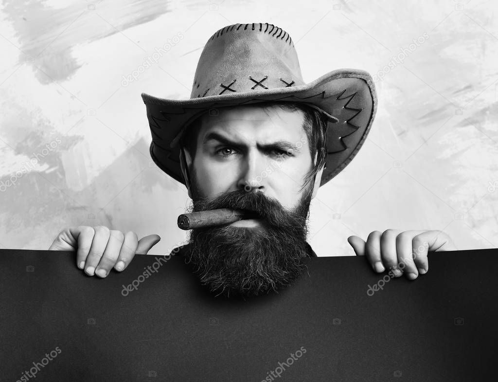 Bearded brutal caucasian hipster cowboy
