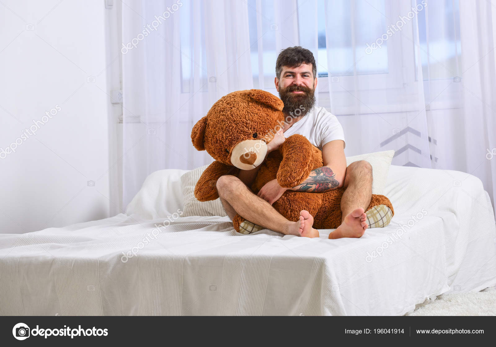 hugging giant teddy bear
