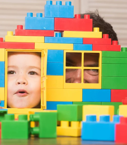 Boy and man play together. Kid and father hide — Stock Photo, Image