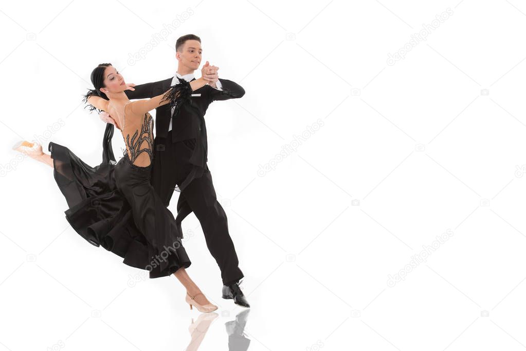 ballroom dance couple in a dance pose isolated on white background. ballroom sensual proffessional dancers dancing walz, tango, slowfox and quickstep ballroom couple dance professional