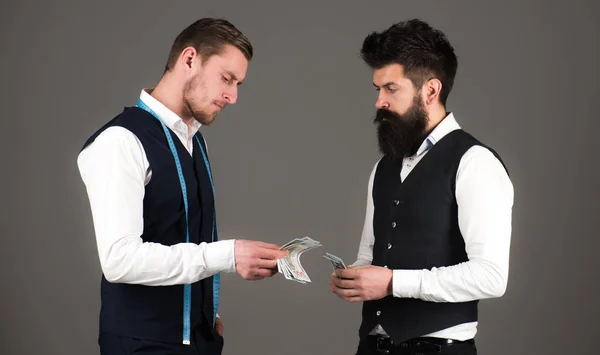 Man with beard pay to macho with measuring tape. — Stock Photo, Image