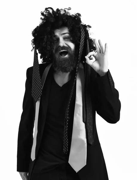 Caucasian hipster in suit and black curly wig — Stock Photo, Image
