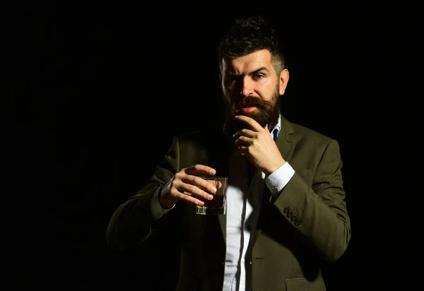 Businessman with beard and beverage on black background — Stock Photo, Image