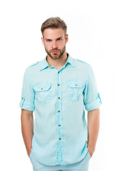 Man on calm face posing confidently with hands in pockets, white background. Guy with bristle wears casual or formal shirt. Fashion concept. Man looks attractive in casual linen blue shirt — Stock Photo, Image