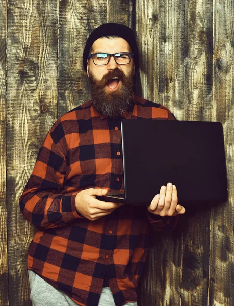 Business man. Bearded brutal caucasian hipster holding laptop — Stock Photo, Image